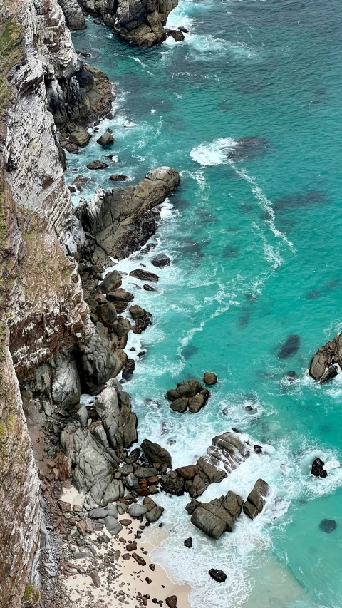 some rocks and water and the ocean