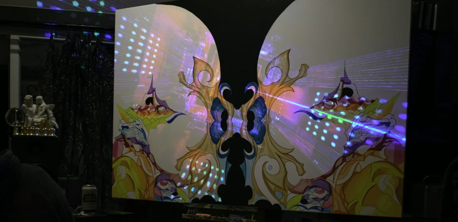 a lighted display with a very colorful erfly with lights