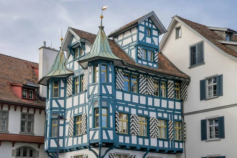 this is an interesting building with blue and white trim