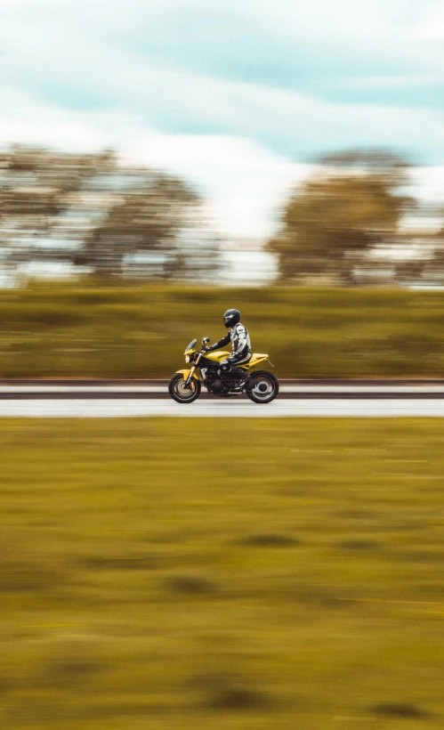 motorcycle rider passing on the road in motion