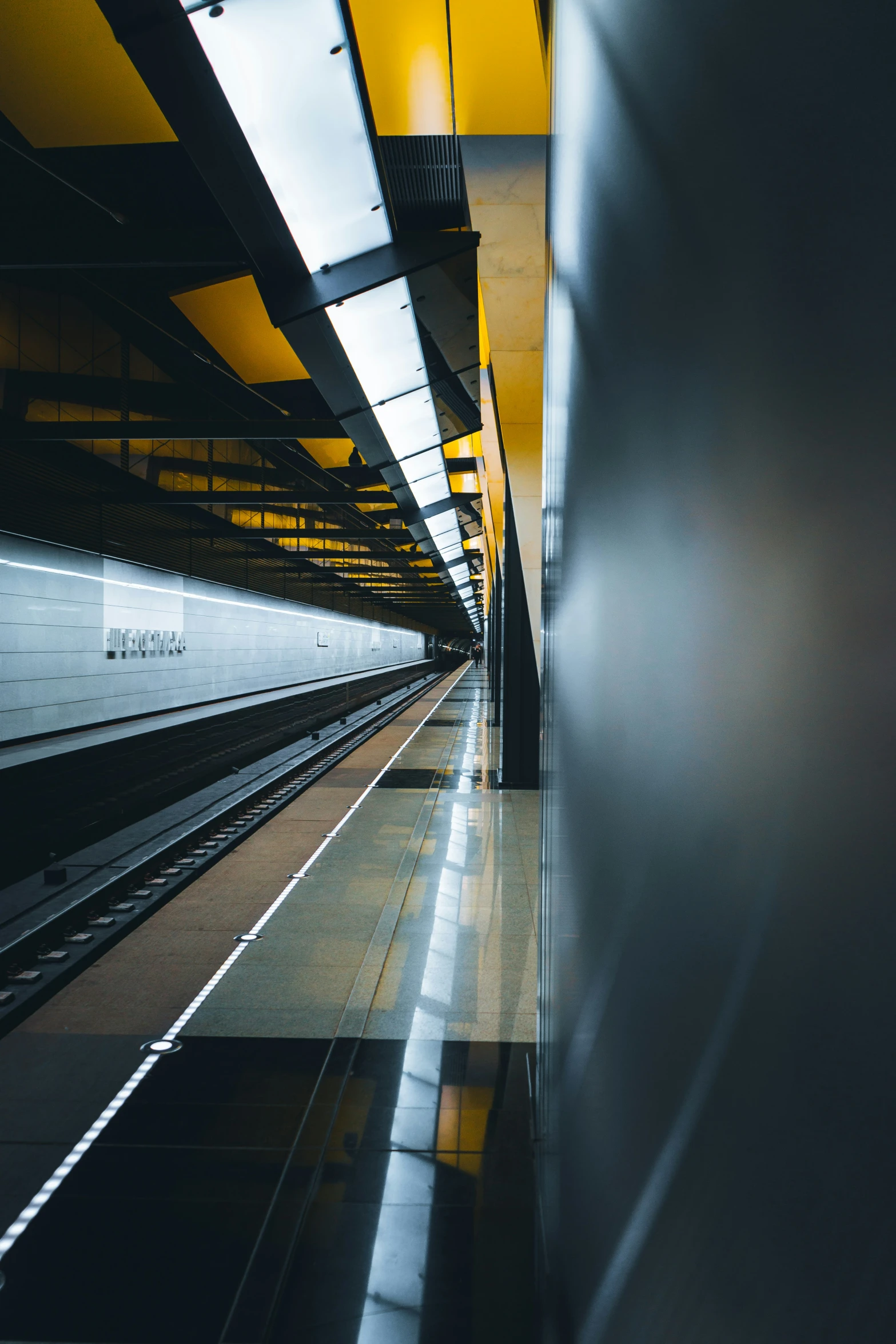 a subway train stopped in the station of a city