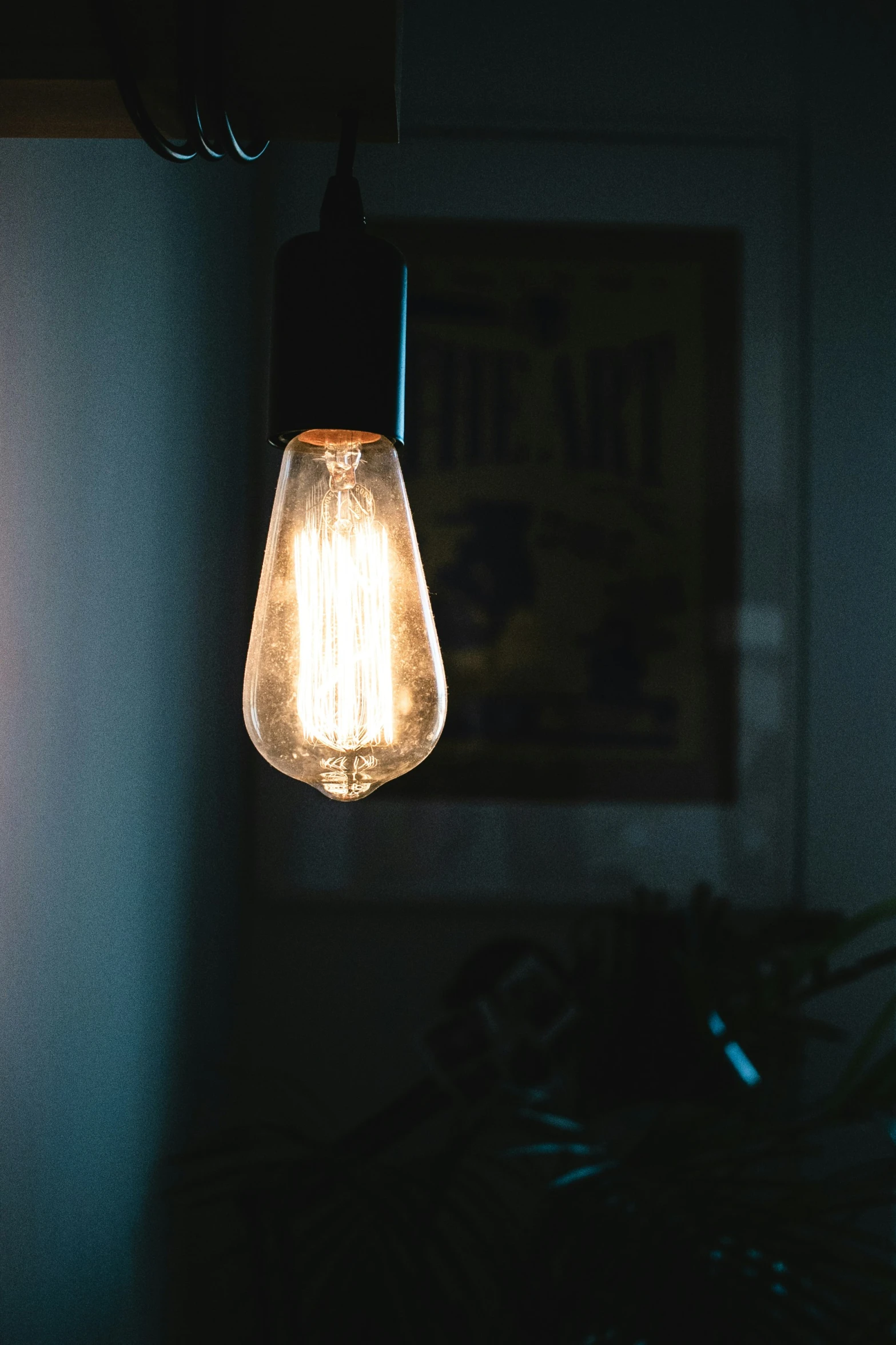 a light bulb hanging from the side of a wall