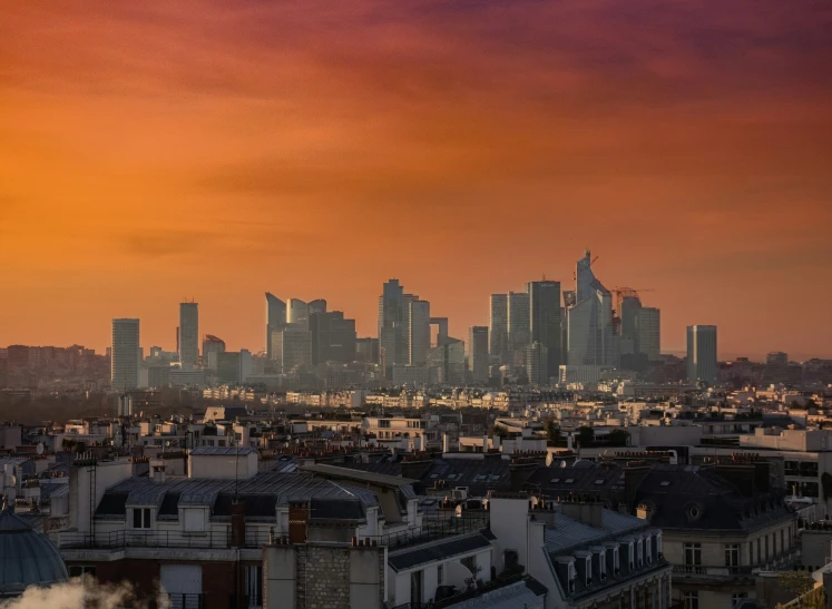 a city skyline is shown with tall buildings