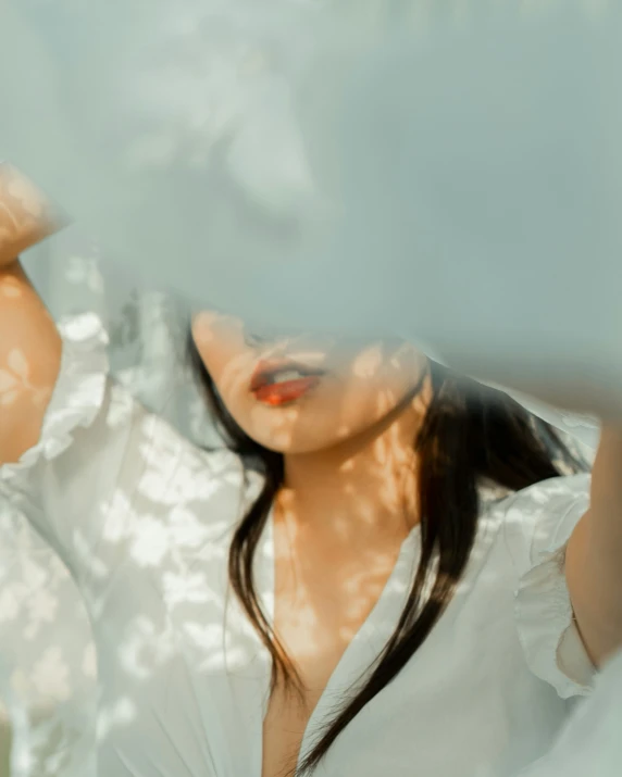 a woman posing in front of a glass wall