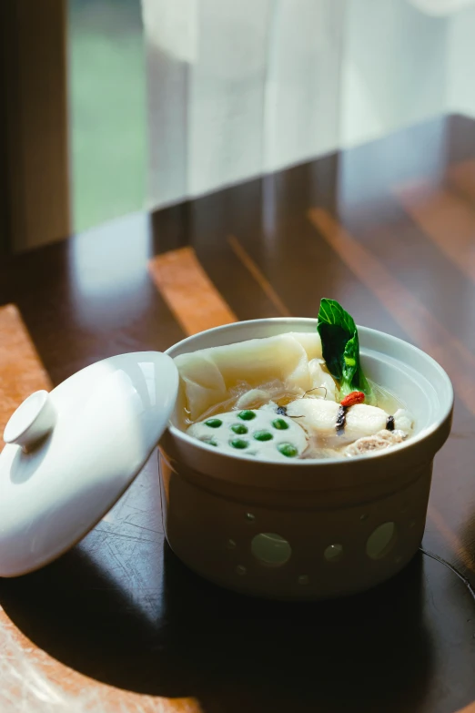 a small bowl of soup on a wooden table