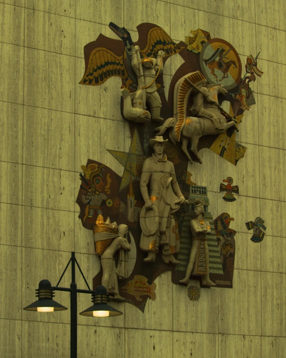 the statue is located on the outside of a building