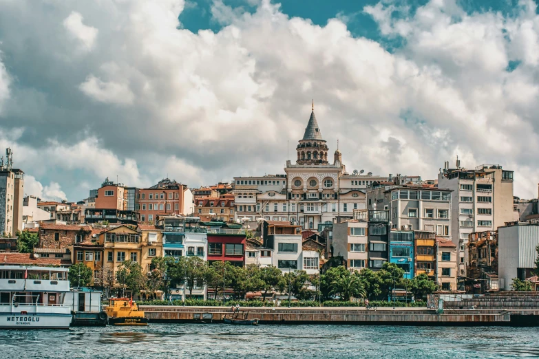 several boats floating in front of a large city