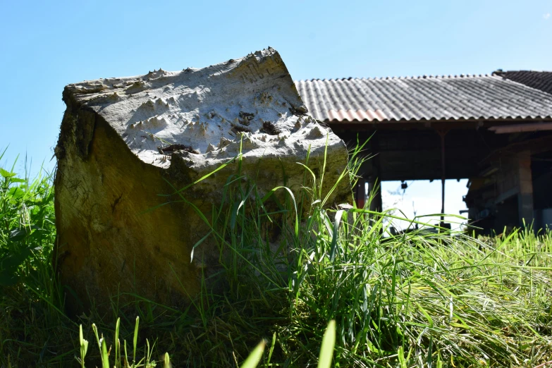 a large stone structure in a grassy field