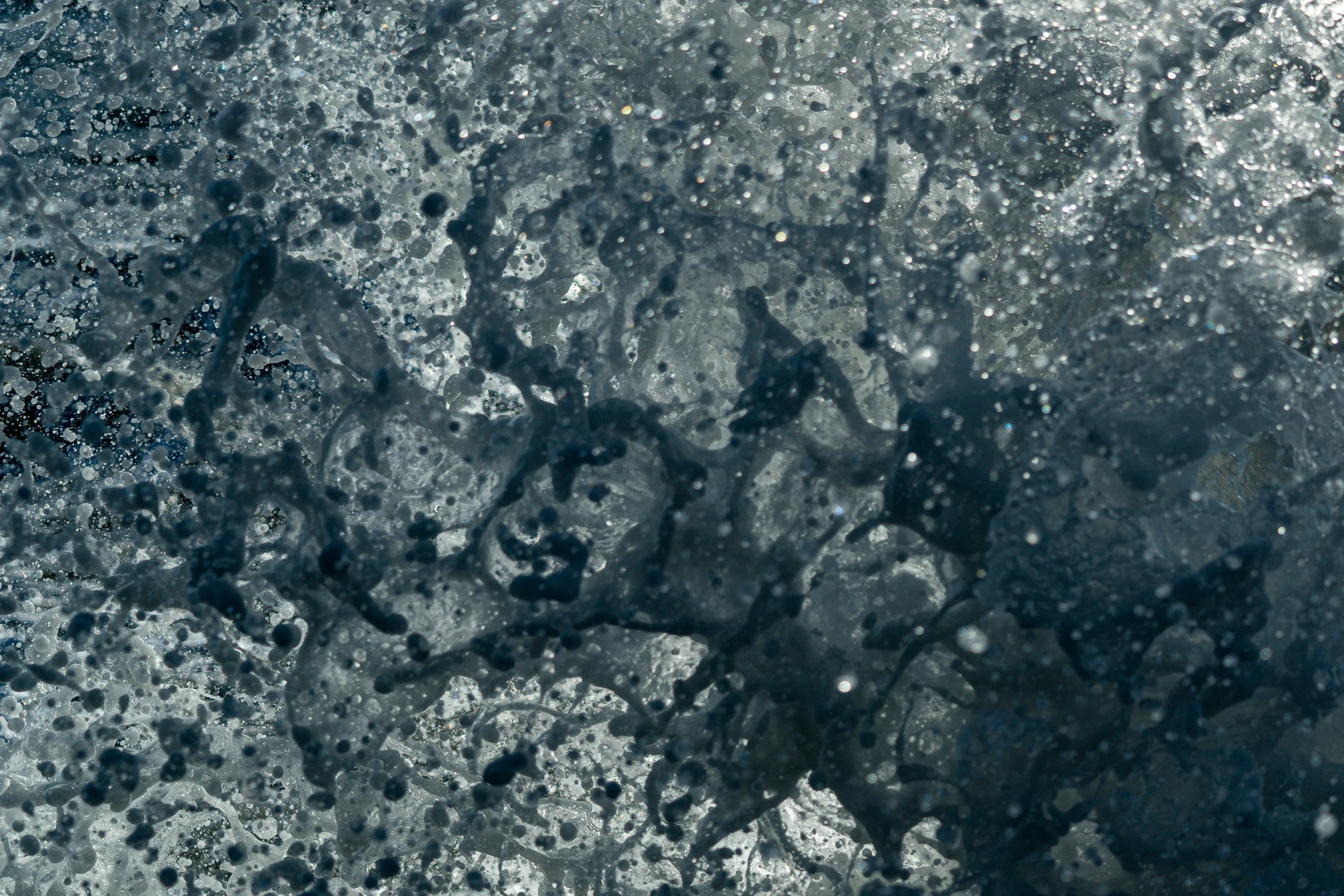 an ice covered sky with bubbles and snow