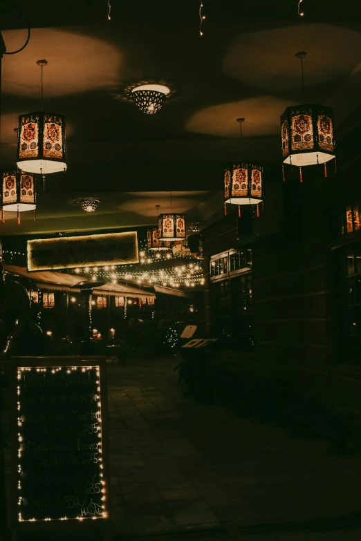 a lighted street scene with lights and christmas decorations