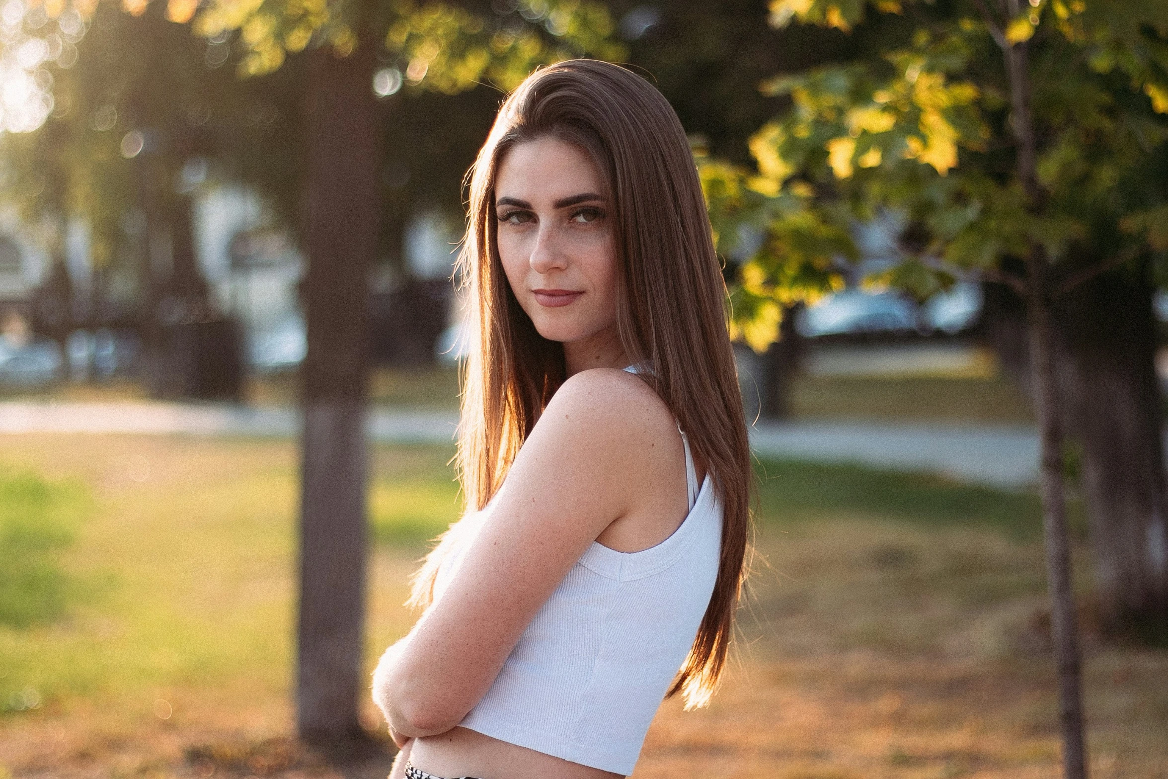 a girl with long hair poses for the camera