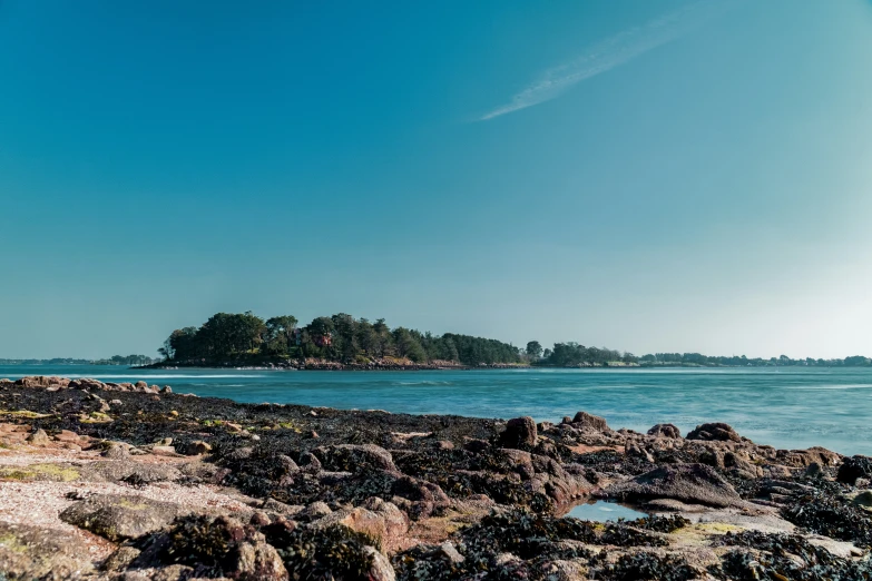 a large body of water sitting between two rocky banks