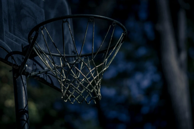 a basketball going through the hoop of a basketball court