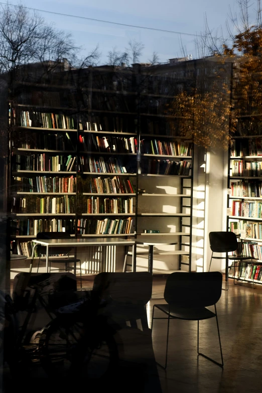 a room filled with book shelves and lots of books