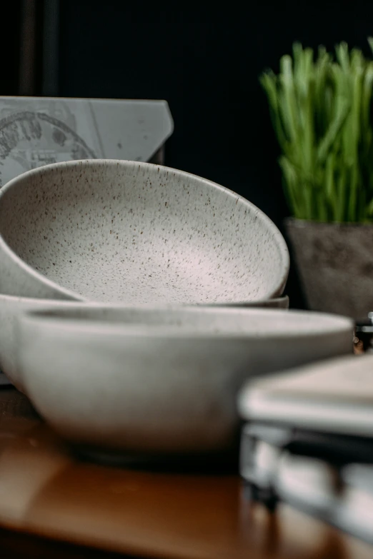 an apple is shown on a table and bowl