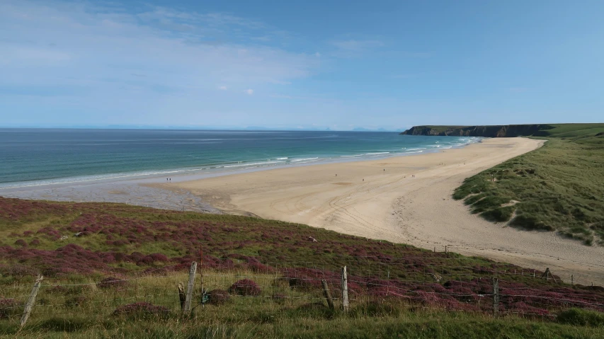 a large body of water sitting next to a beach