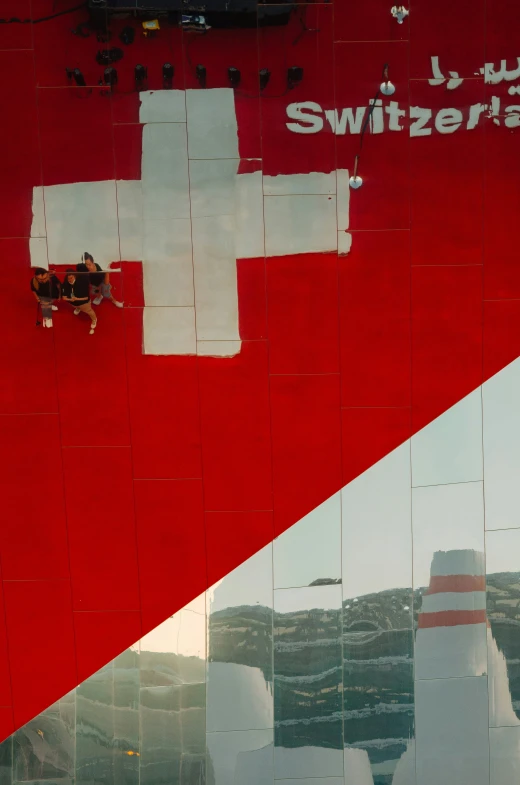 reflection of an american and switzerland cross in windows