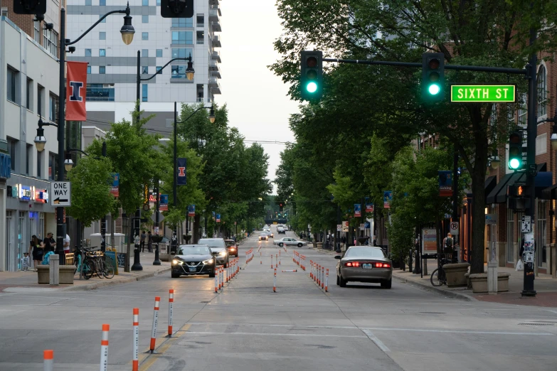 the street has cones in both sides of the street