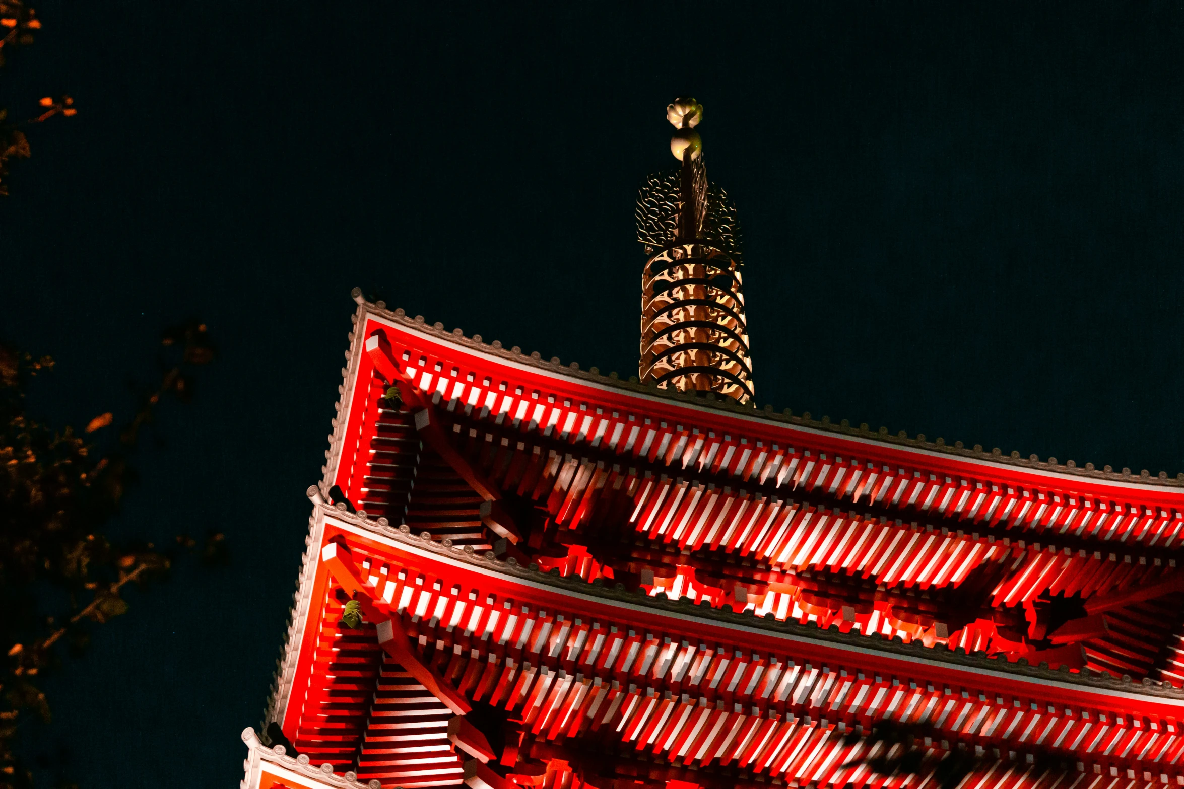 the large tower has four levels with red lights