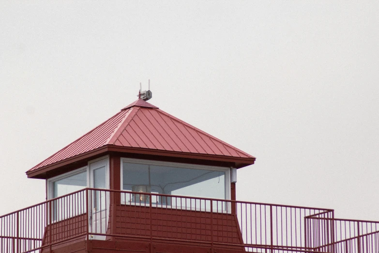 the red building has a white cupola