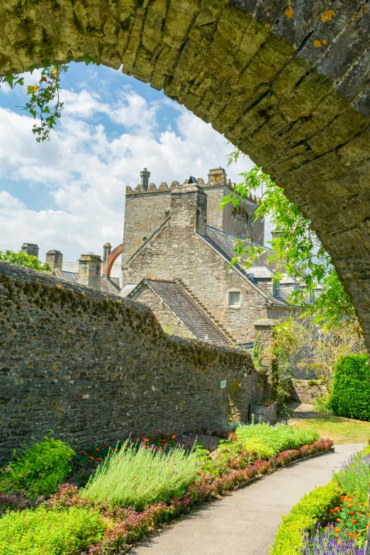 a path in front of some stone buildings