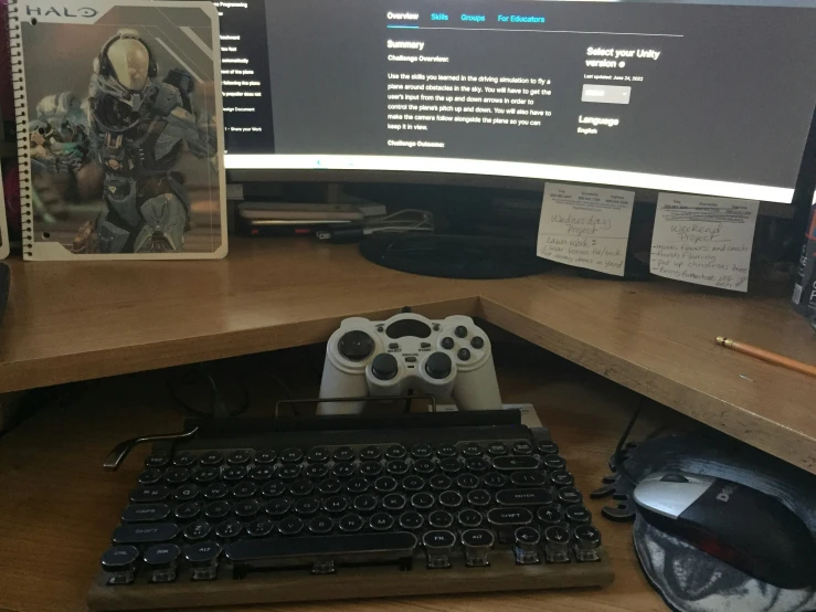 a black keyboard sitting next to a monitor