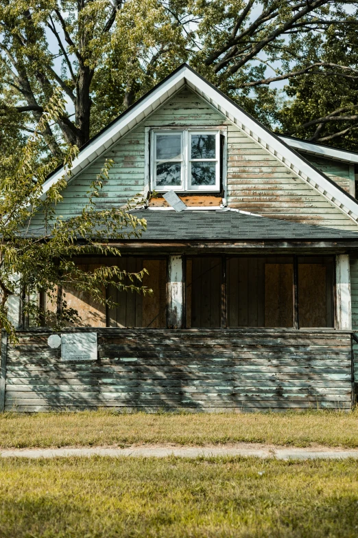 an old home with grass in front