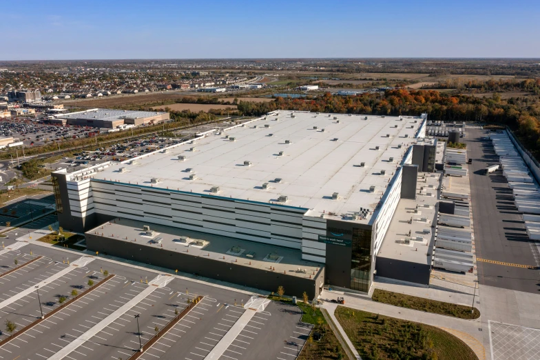 an aerial view of an aerial building and parking lot