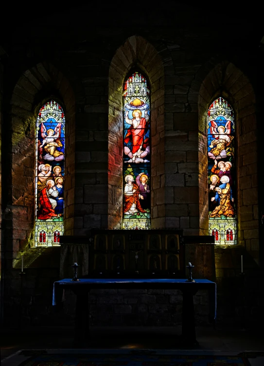 two stained glass windows in an old cathedral