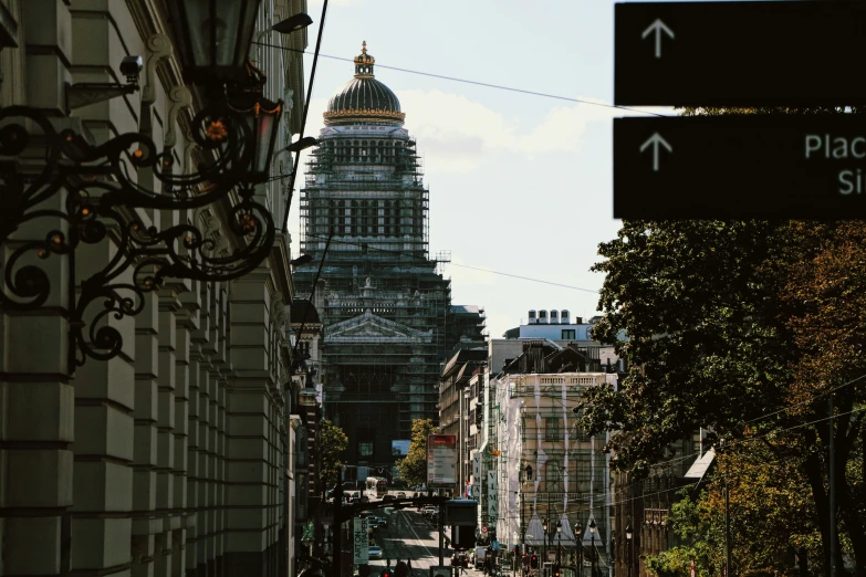 a street sign on a city street next to some buildings