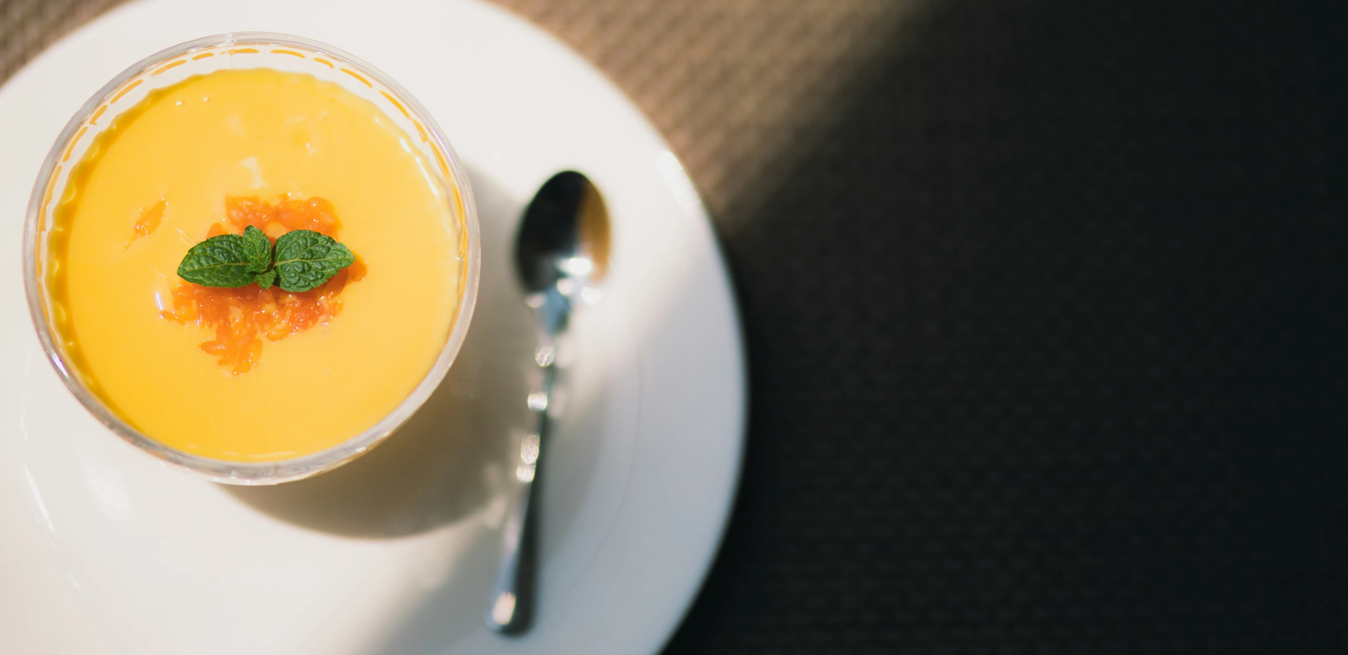 a white bowl full of food sitting on top of a plate