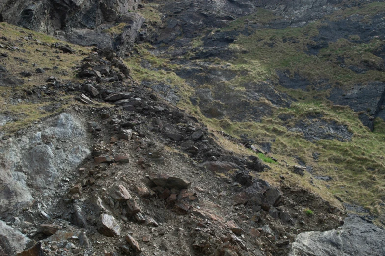 the mountain is covered with very rough rock