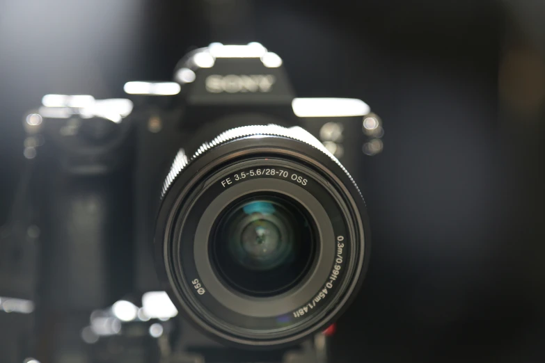 an lens pointed toward a camera in the background