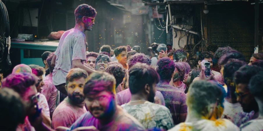 a man is surrounded by colored confetti