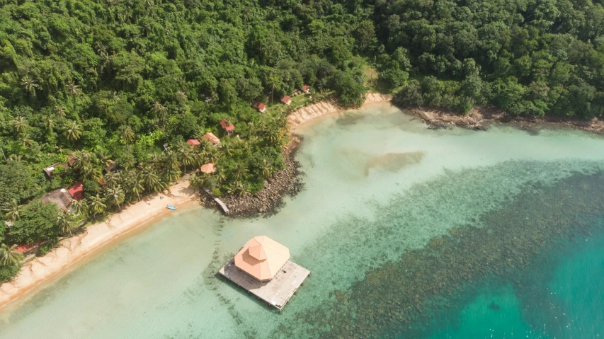 this is a picture of an aerial view of a hut with trees surrounding