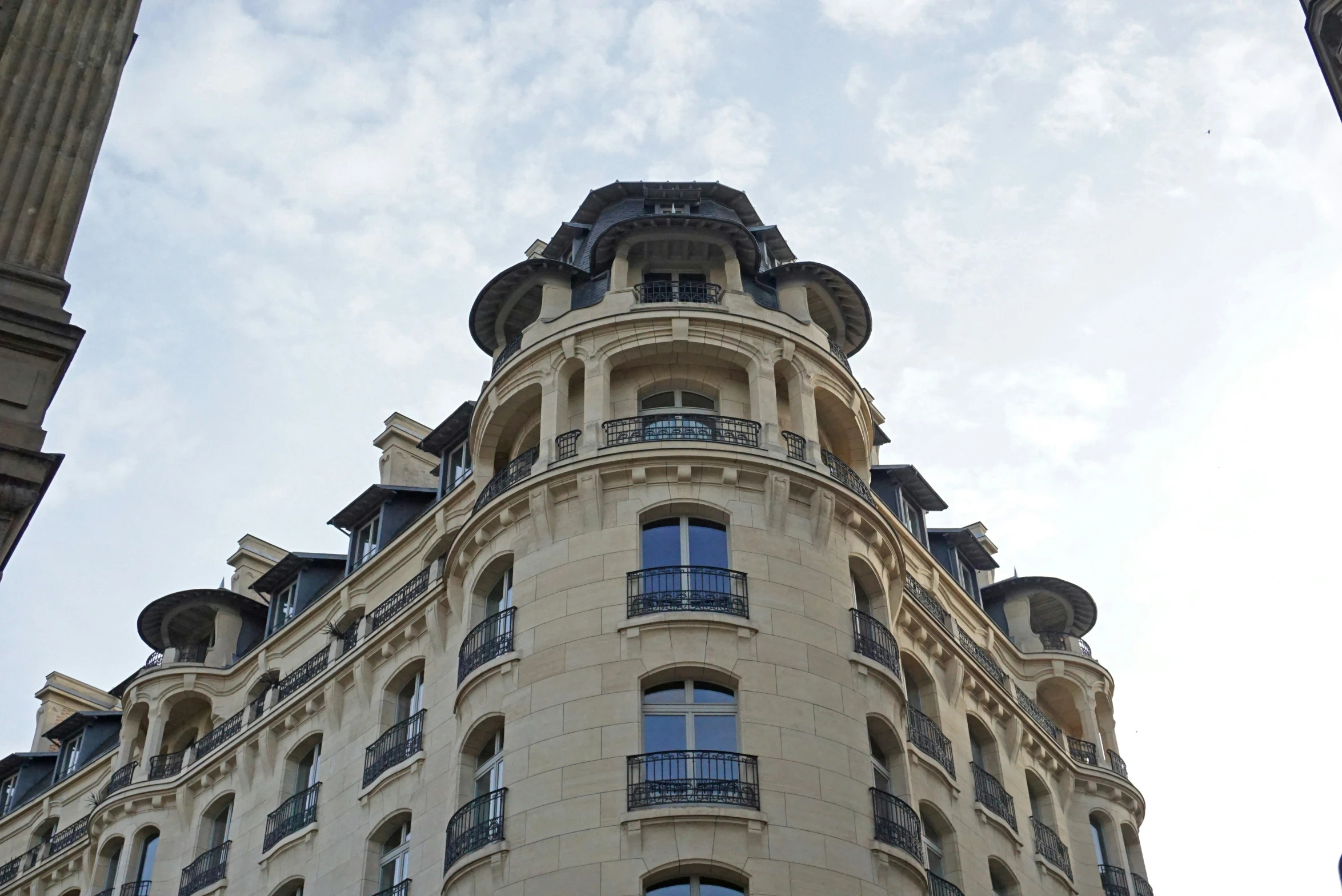 this is a picture of a very tall building with many balconies