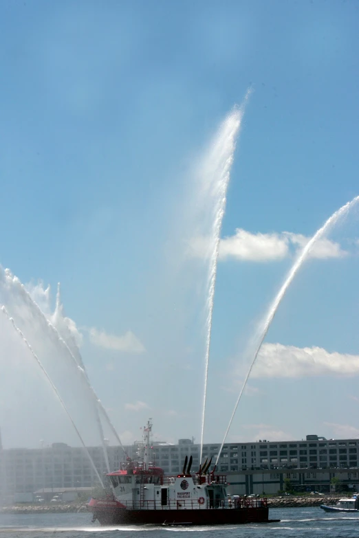 there are several water jets shooting from a boat