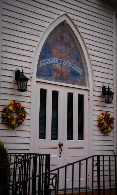 an entrance to a building with decorations on the wall