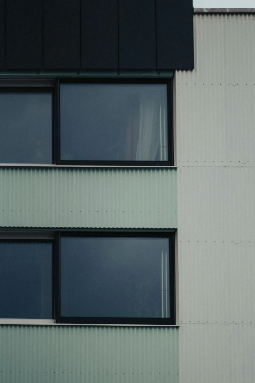 a close up view of the side of a building with a window