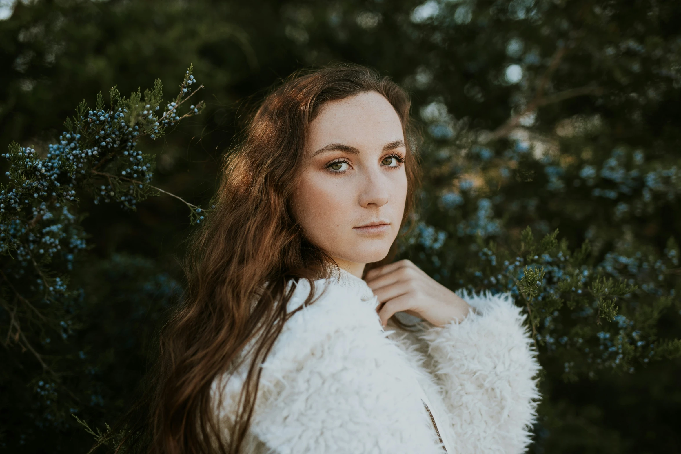 a girl wearing a jacket with the collar up