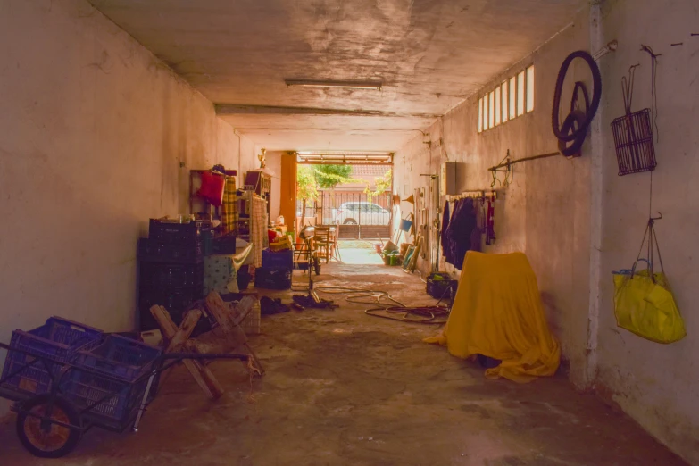 an empty hallway has yellow blankets and chairs