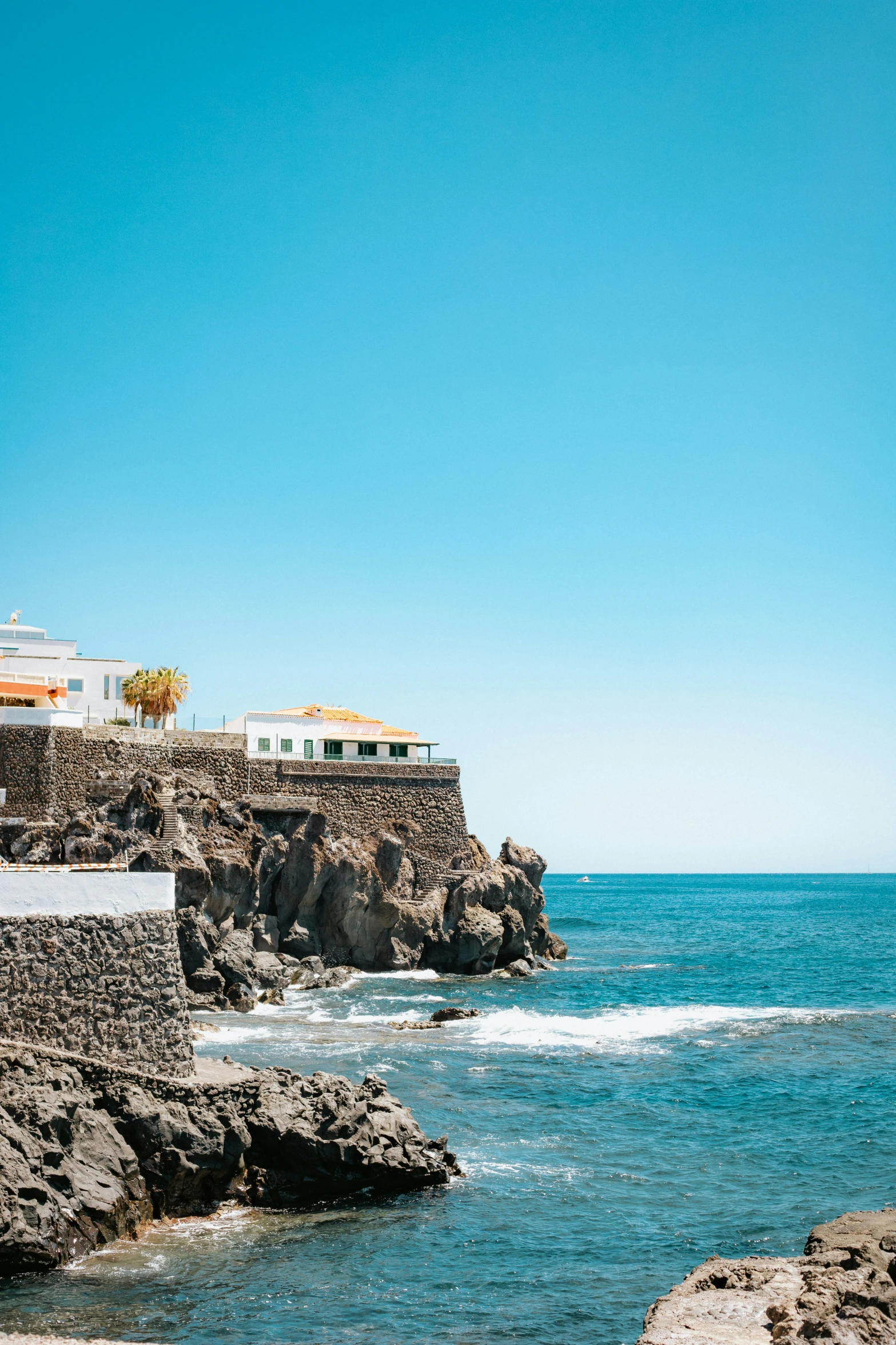 a rocky beach with some clear water