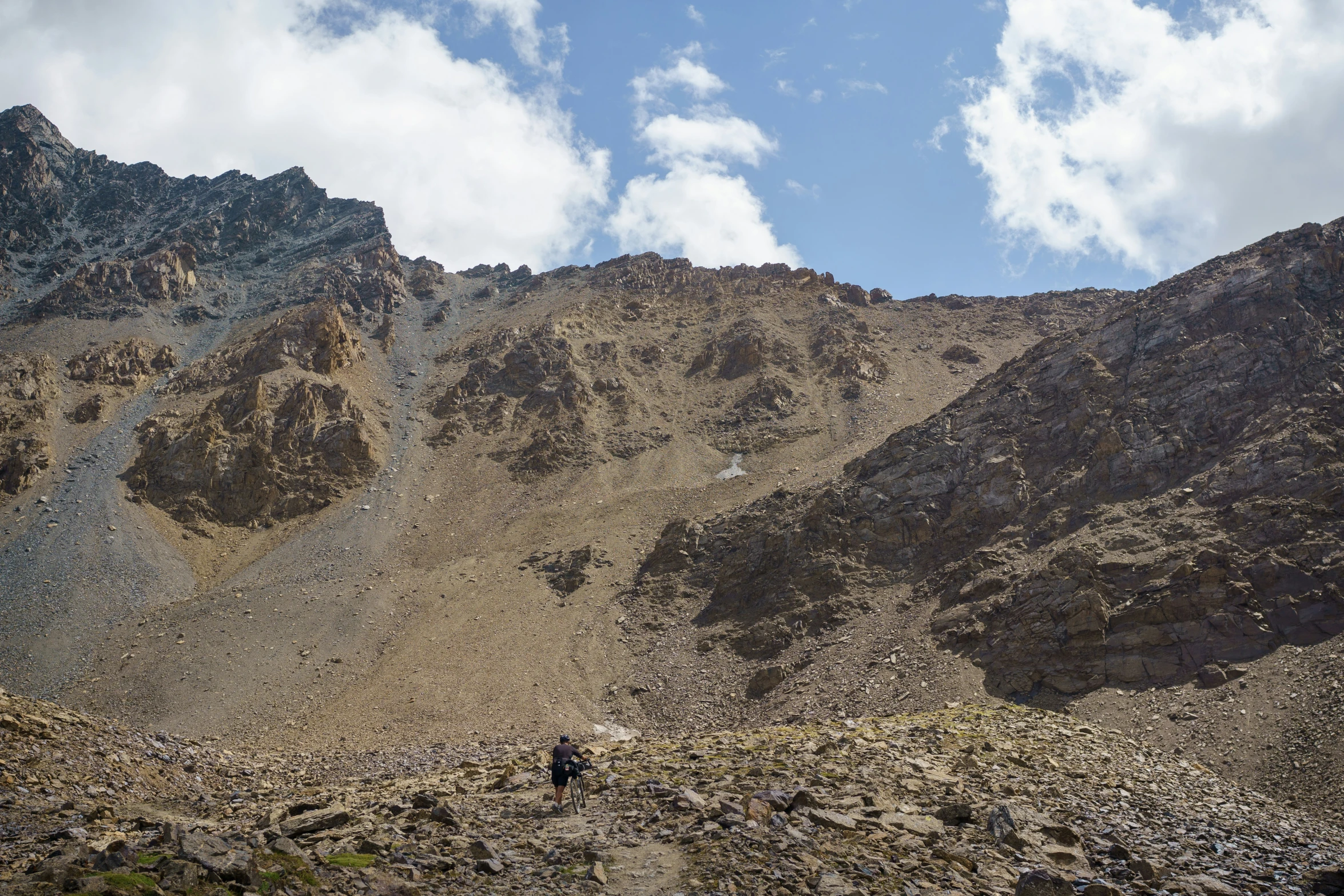 the mountains in the distance are very steep