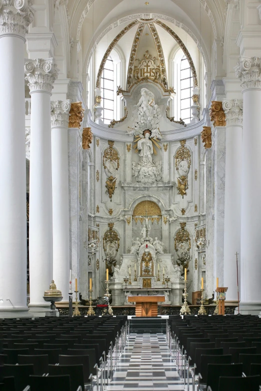 the inside of a church, with black and white floors