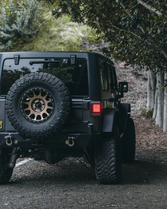 a black jeep is parked in the street