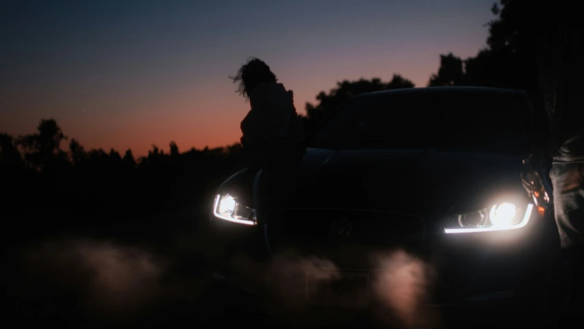 a person is standing next to a car