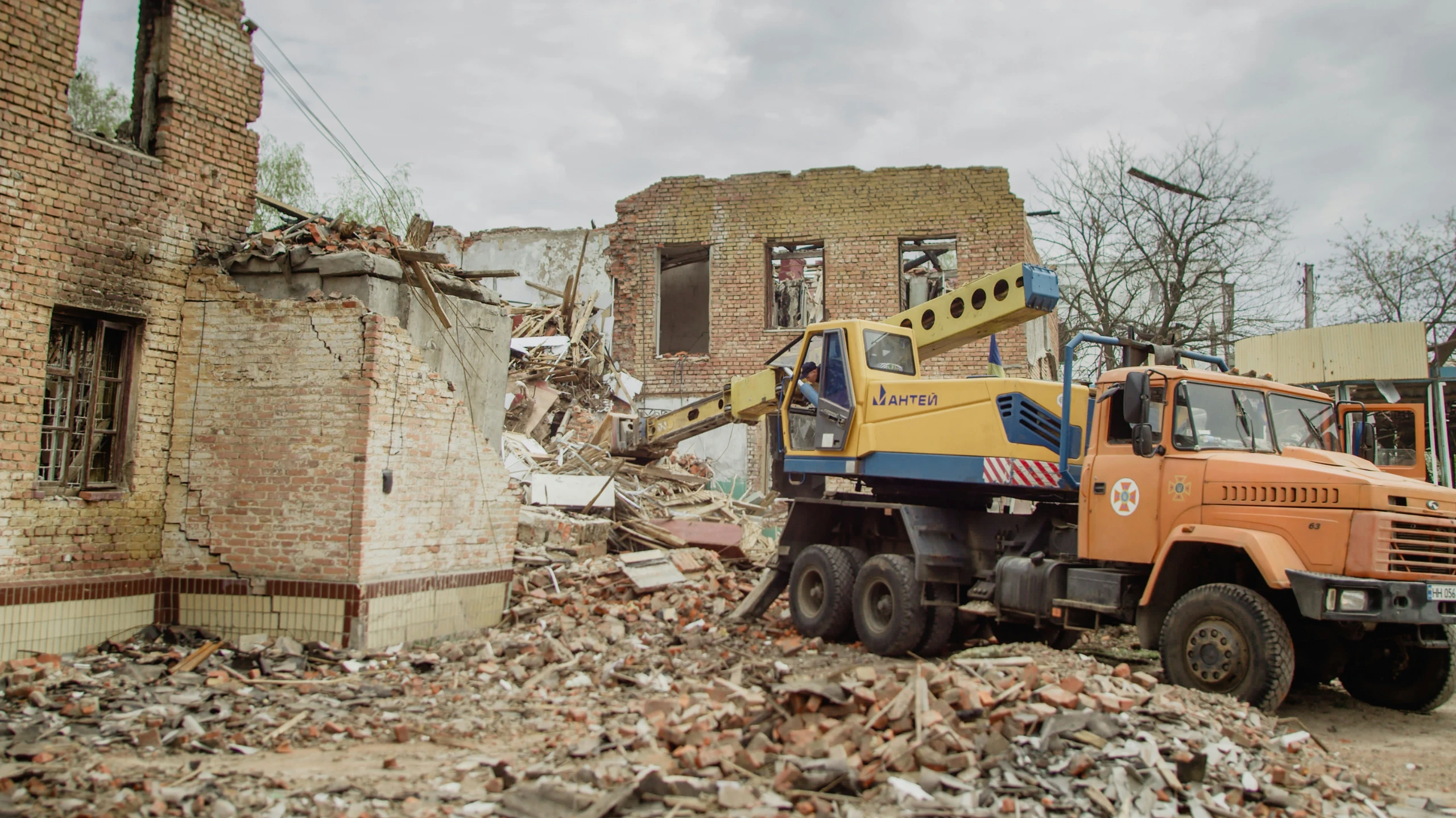 a work truck is in the rubble of an abandoned building