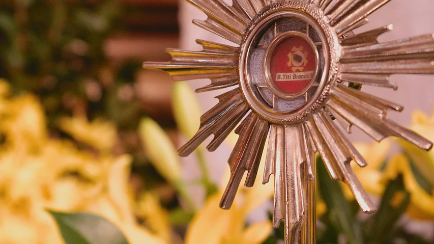 an ornate golden flower with multiple small ornate details