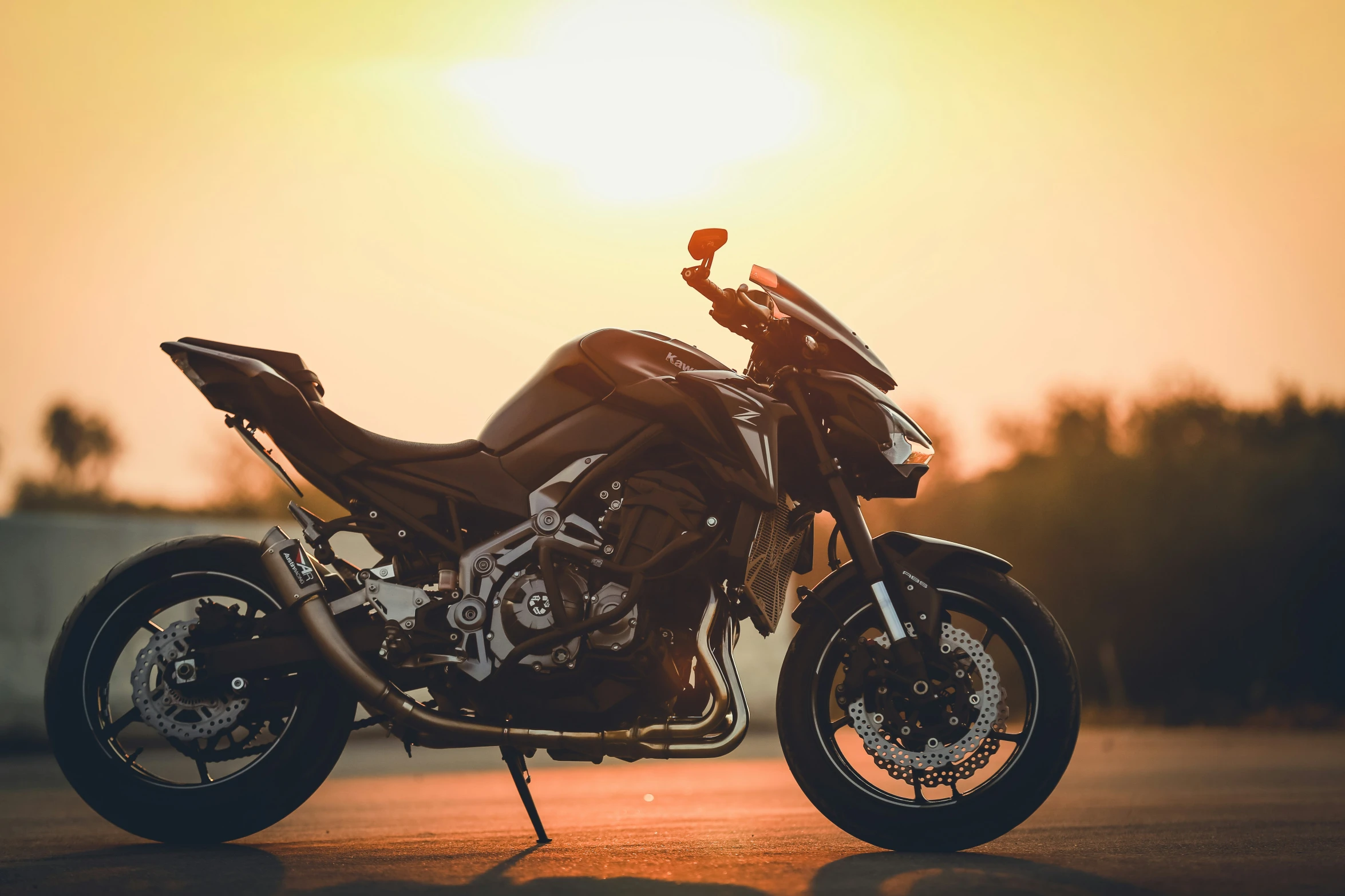 motorcycle sitting parked in the middle of the road