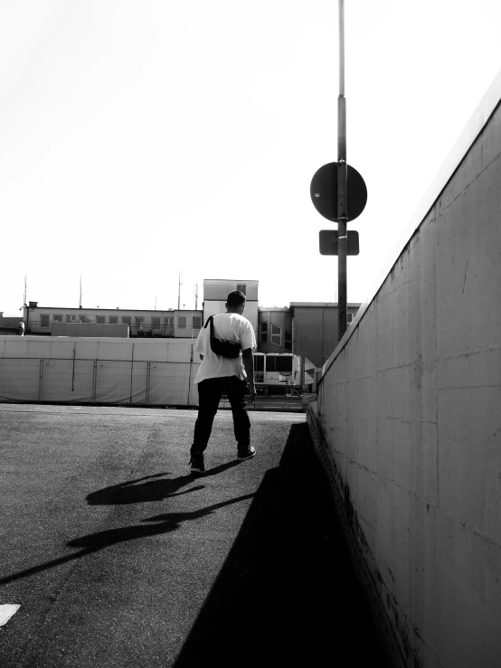 a person with a backpack walking along a street